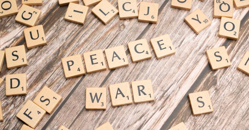 Conflict Resolution - The word peace written on wooden letters
