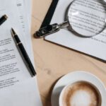 Cover Letter - Coffee, Pen and Magnifying Glass on Papers